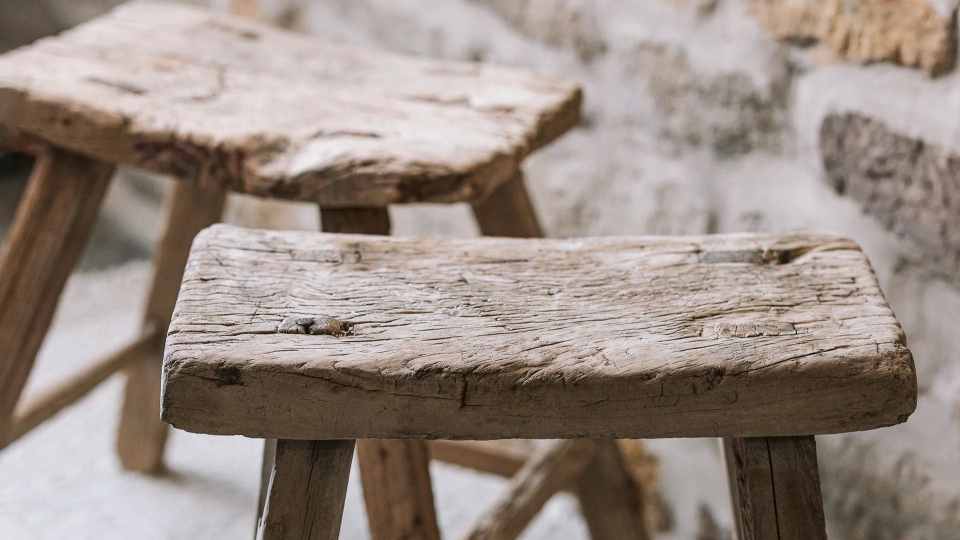 Close up of rustic wood stools.