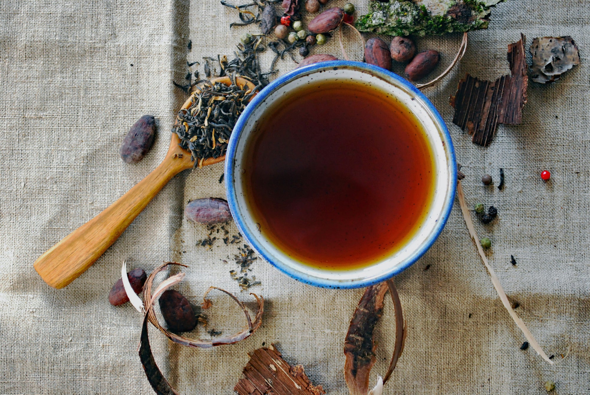 The best herbal tea with spoon and spices around