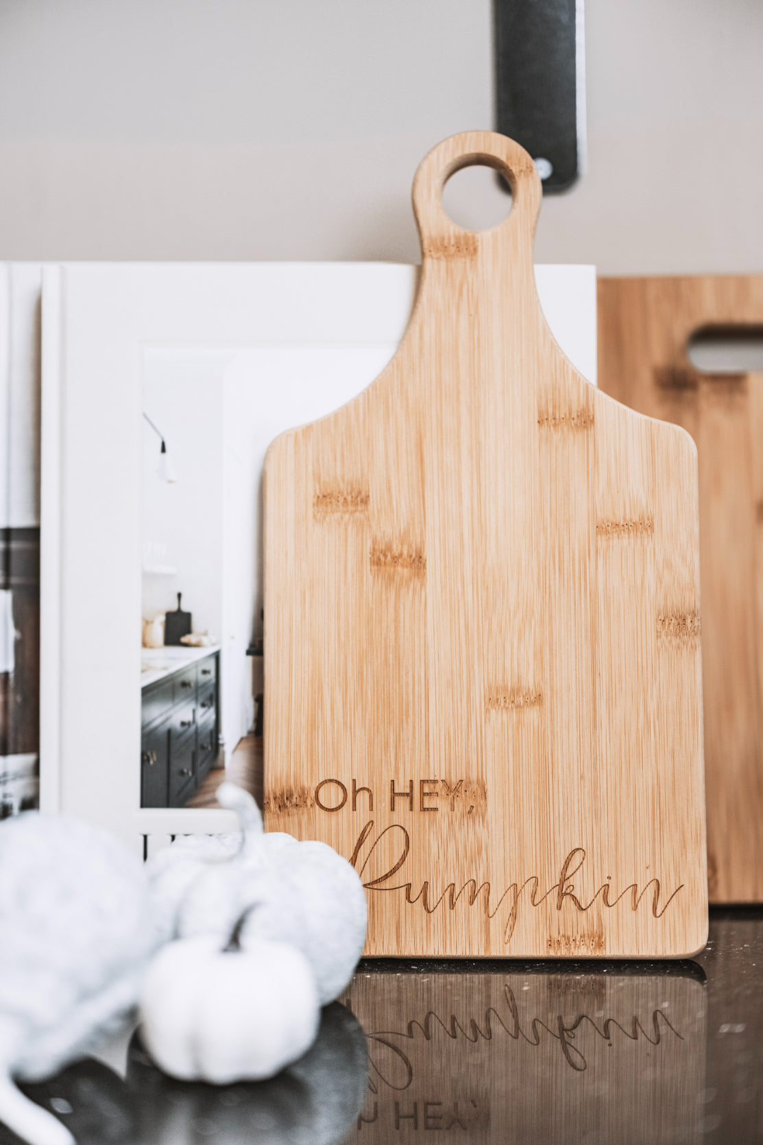 Bamboo wooden board with 'hey pumpkin' engraving.