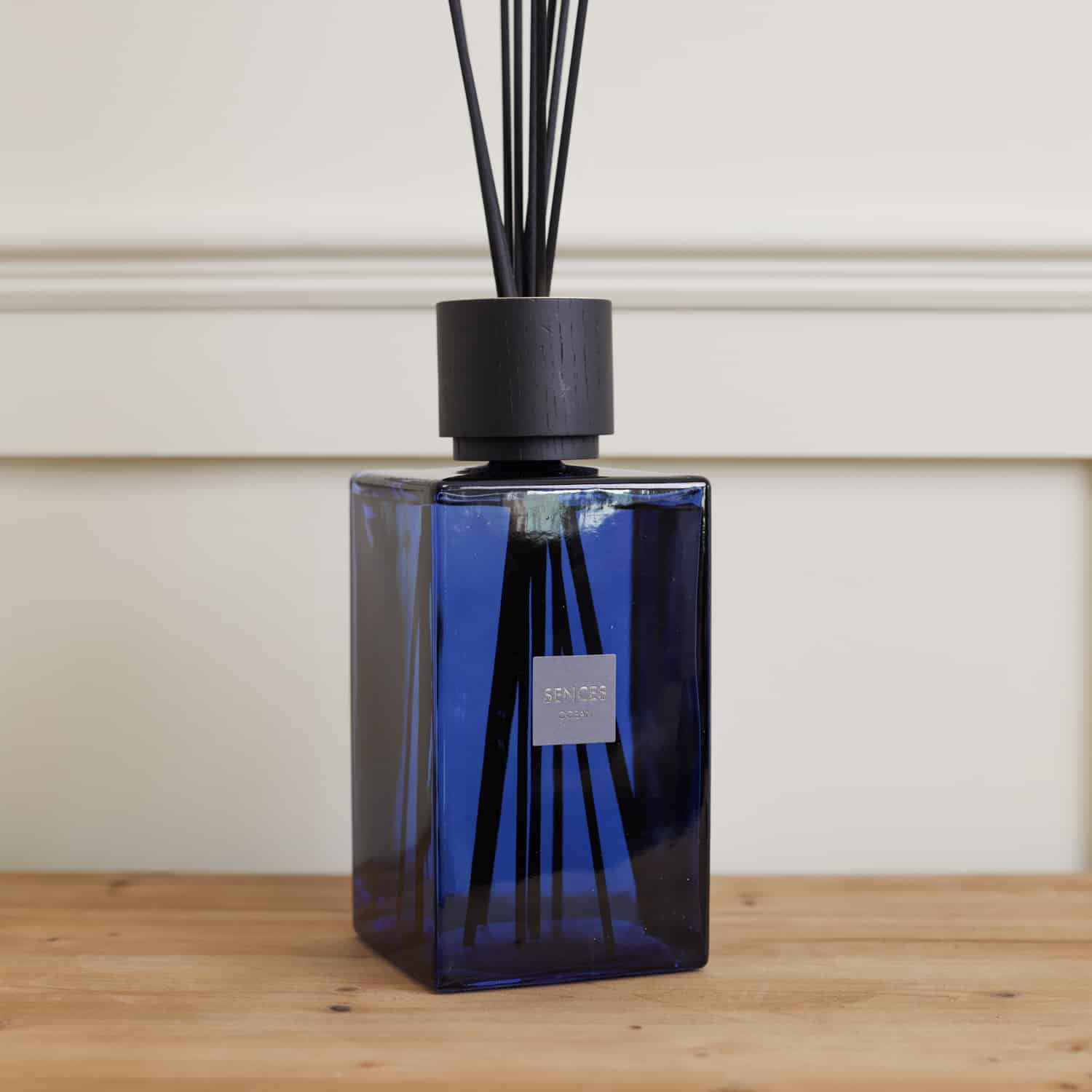 Sences Ocean Blue Extra Large Reed Diffuser side view on wooden console