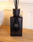 Sences Alang Alang Onyx Extra Large Reed Diffuser on wooden console styled with lamp