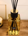 Sences Neroli Extra Large Reed Diffuser close up view of the reeds and neck on wooden console table.