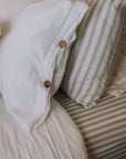 Striped Fitted Sheet with muslin bedding.