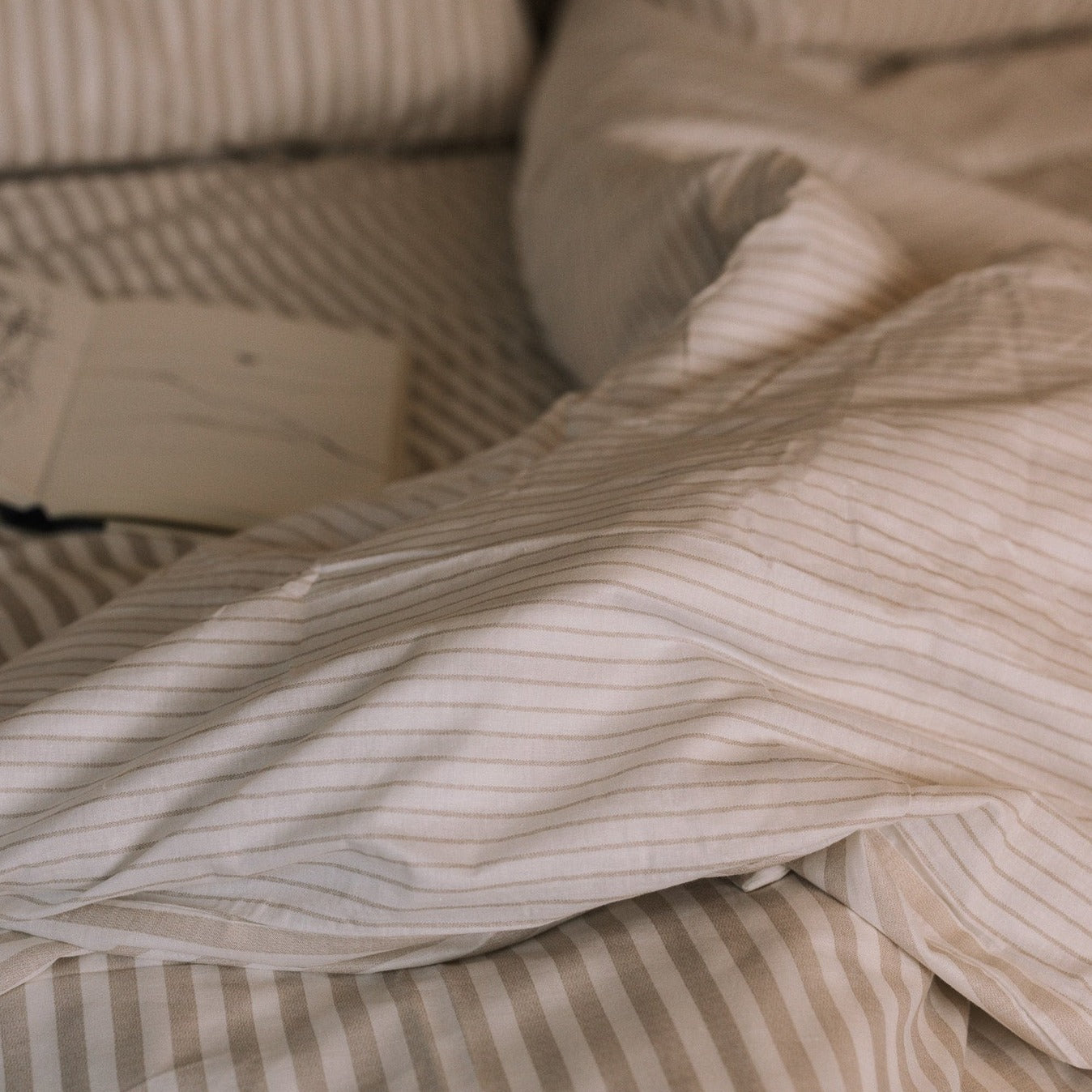 Striped neutral bedding.