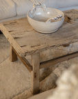 A Reclaimed Wood Coffee Table with ceramic bowl.