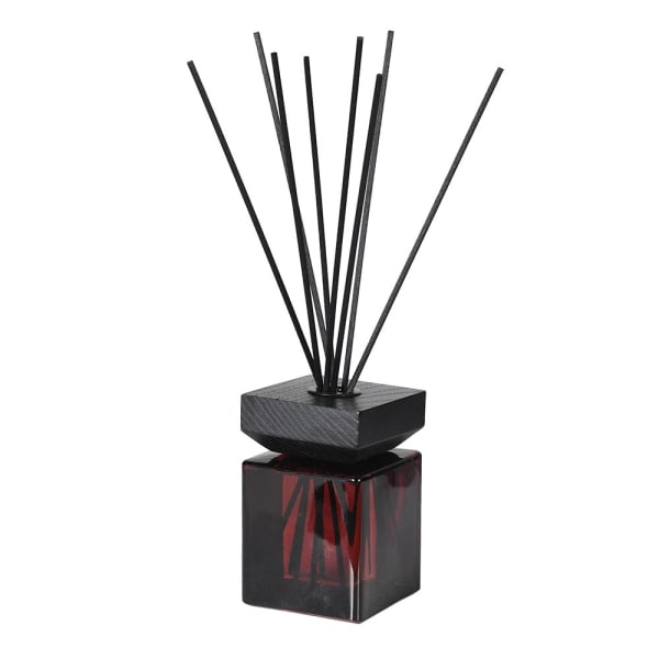 Burgundy and black reed diffuser.