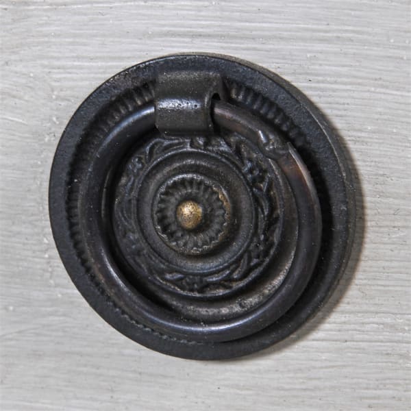 Close up of iron hardware ring handle.