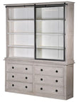 6 drawer white washed storage cabinet with iron hardware and glass sliding door, slid to the right.