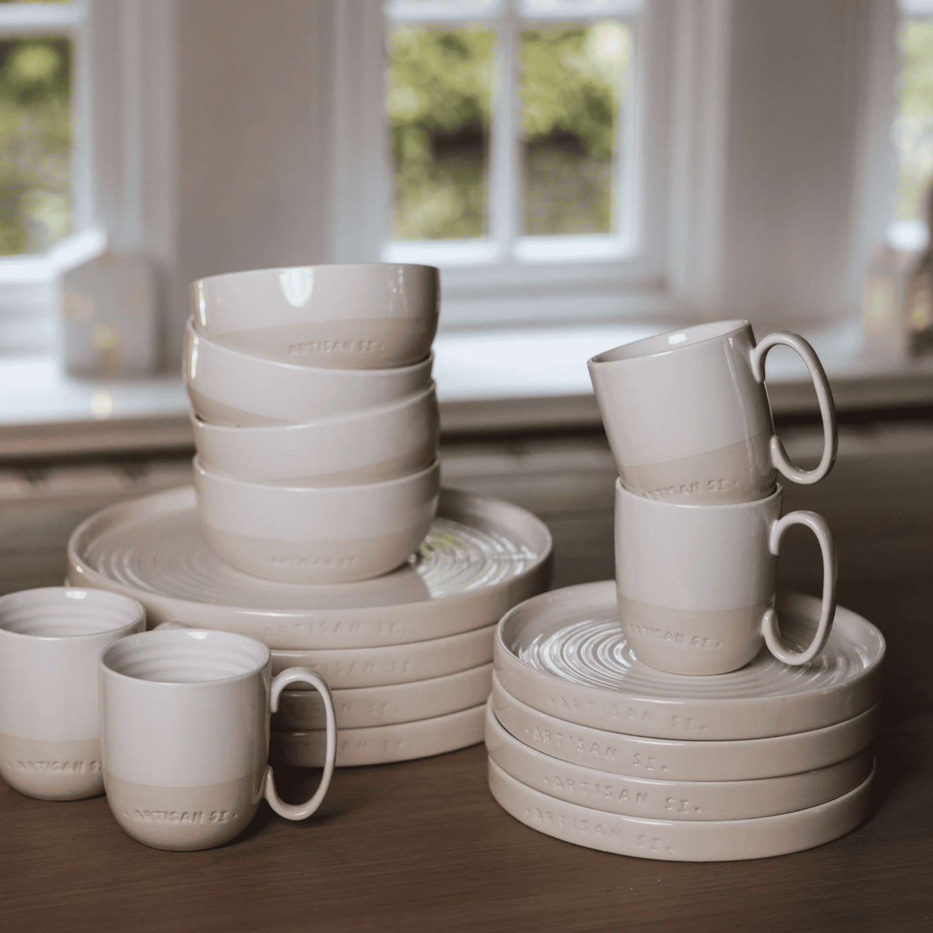a collection of cream stoneware crockrery