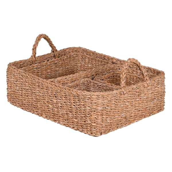 Woven seagrass basket set, stacked in one pile.