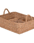 Woven seagrass basket set, stacked in one pile.