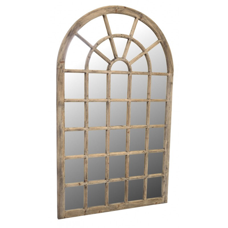 Tall arch mirror with wooden frame and panelling at an angle.