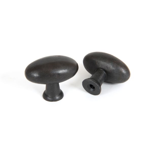 Pair of beeswax oval cabinet knobs.