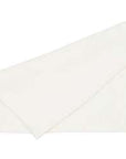 White linen napkin with folded over edge.