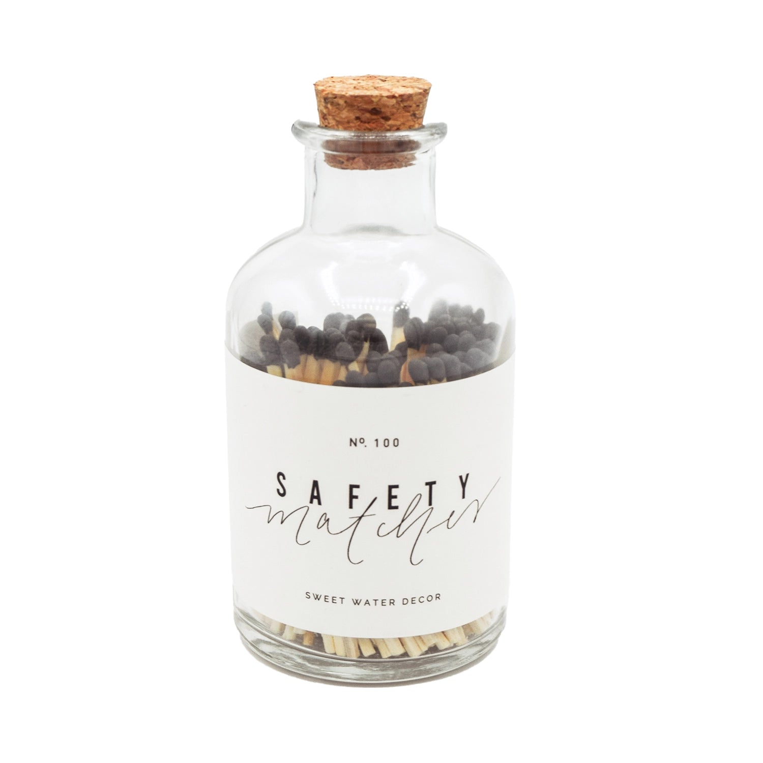 Clear apothecary jar with black tipped matches.