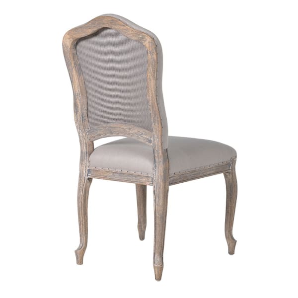 French stone coloured upholstered dining chair from the back.