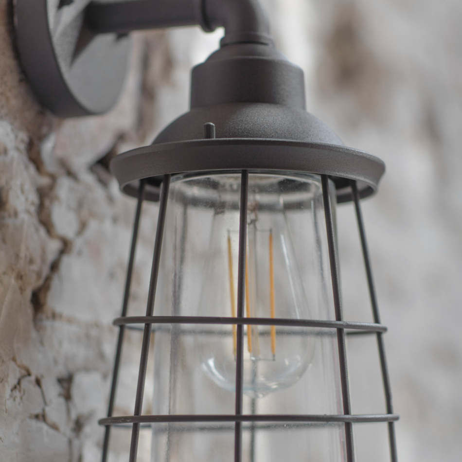 Dalton Black Outdoor Wall Light on exposed stone wall