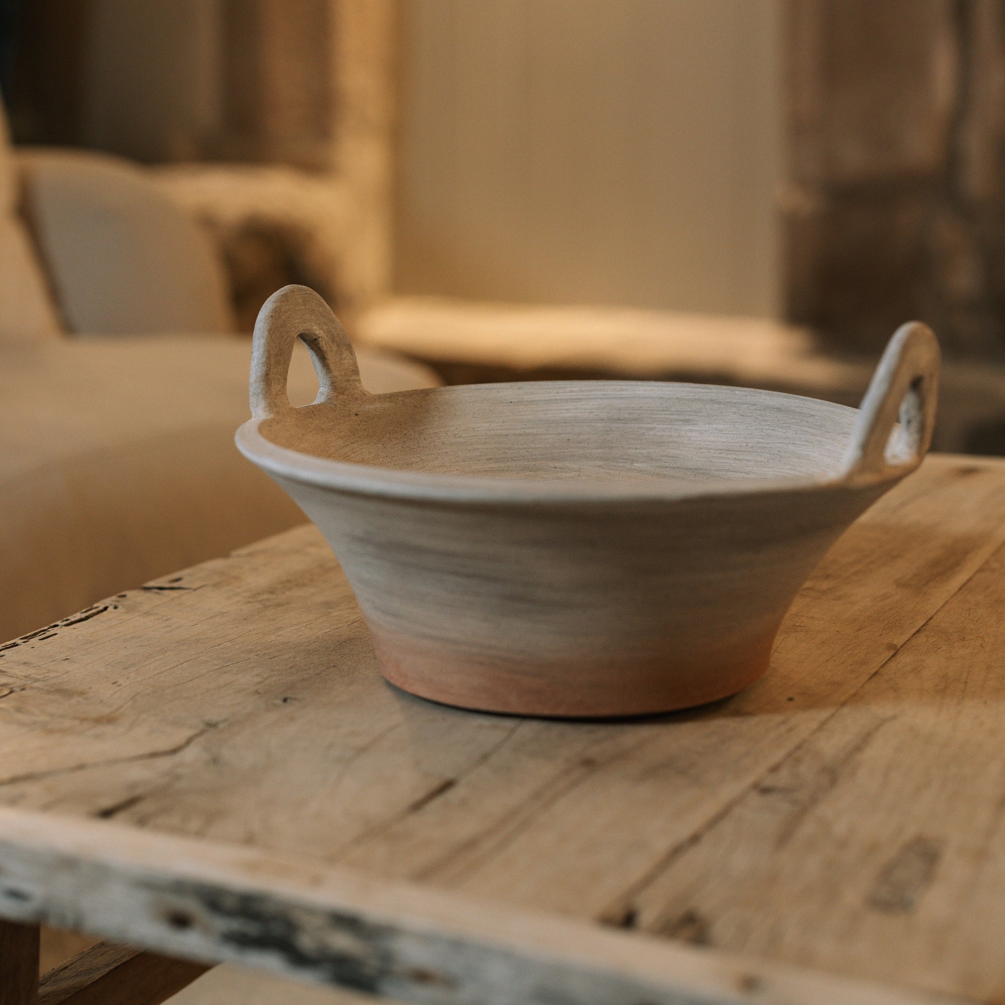 Eli Terracotta Decorative Bowl on wooden coffee table.