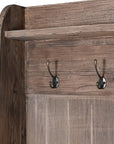 Close up of hooks on wooden bench.