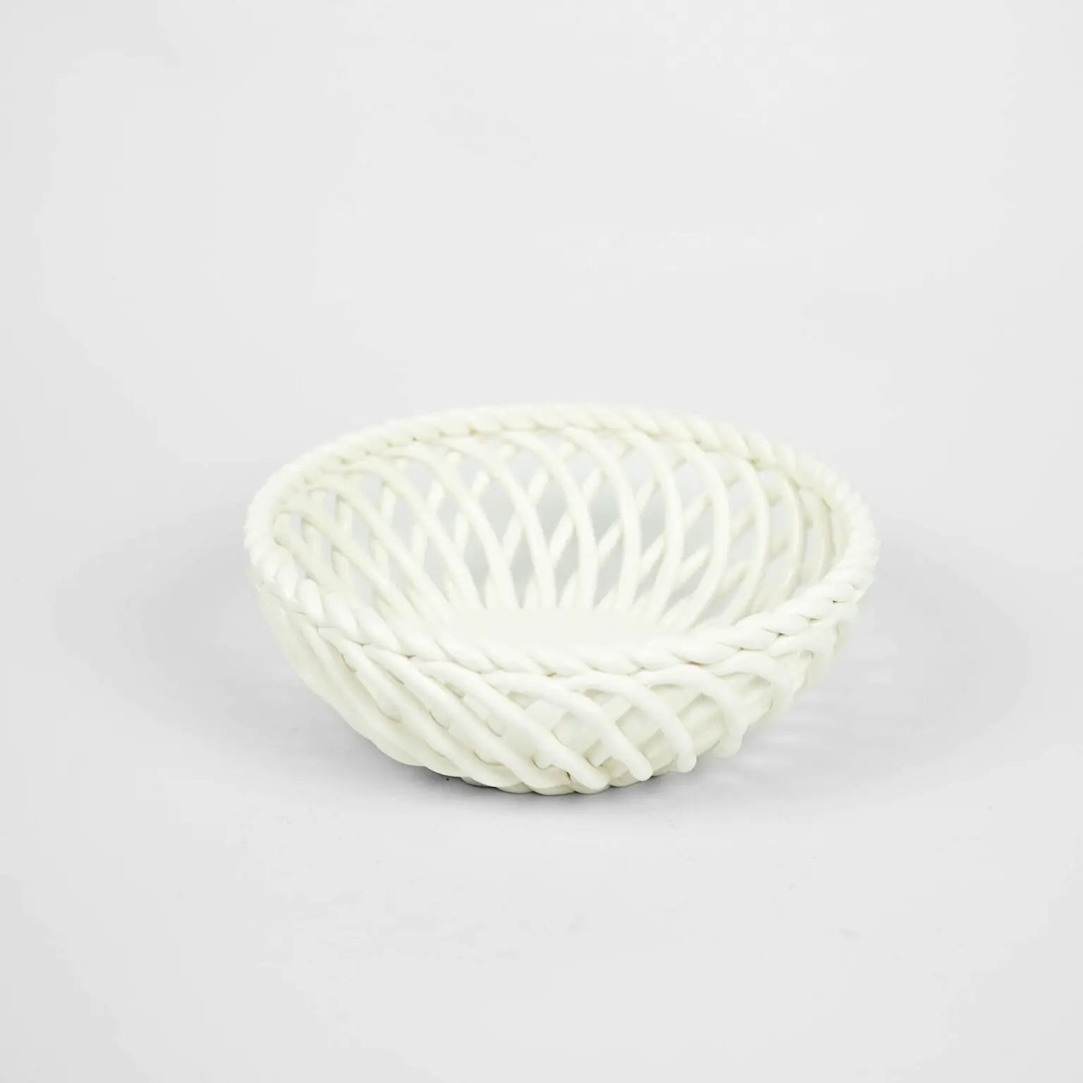 White porcelain basket bowl product image.