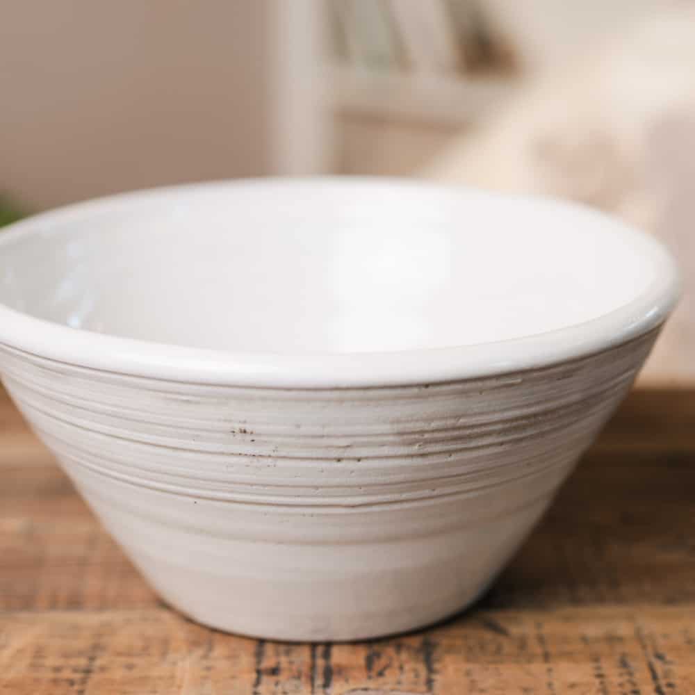 White ridged ceramic bowl with view of the inside.