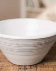 White ridged ceramic bowl with view of the inside.