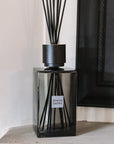 Extra large grey sences reed diffuser on stone mantle.