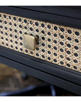 Close up of rattan front drawer in wooden desk.