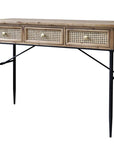 Wooden desk with drawers with rattan front and black legs.