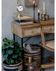 Close up of office desk with drawers and office decor.