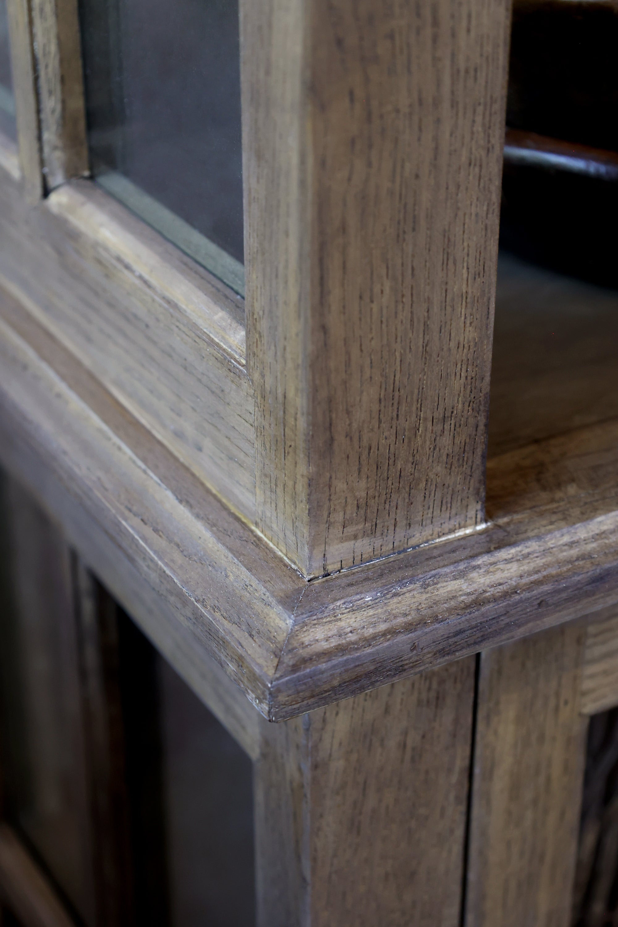 Close up of natural grain on wood display cabinet.