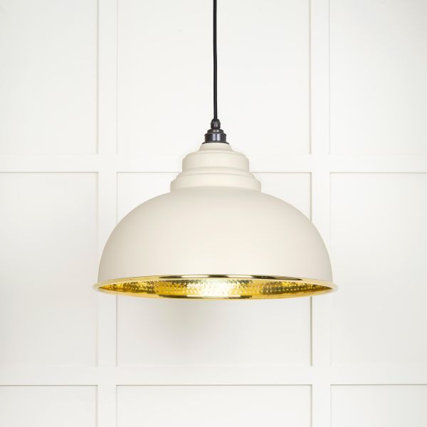 Shade on hammered brass pendant light in teasel.