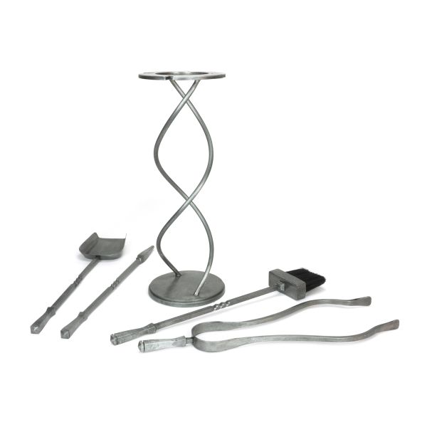 Pewter spiral fireside companion set with 4 tools off the stand.