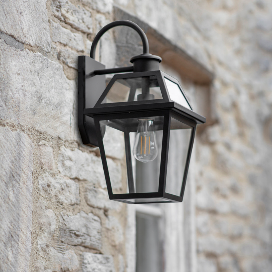 Black Outdoor Wall Light on stone external wall.