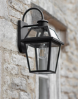 Black Outdoor Wall Light on stone external wall.