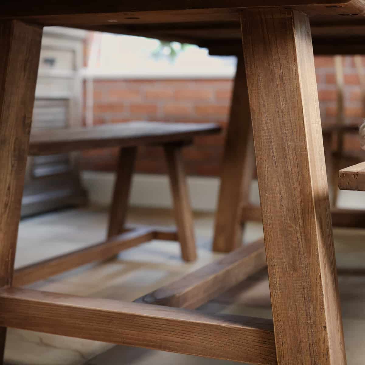 Elm dining table close up of legs.