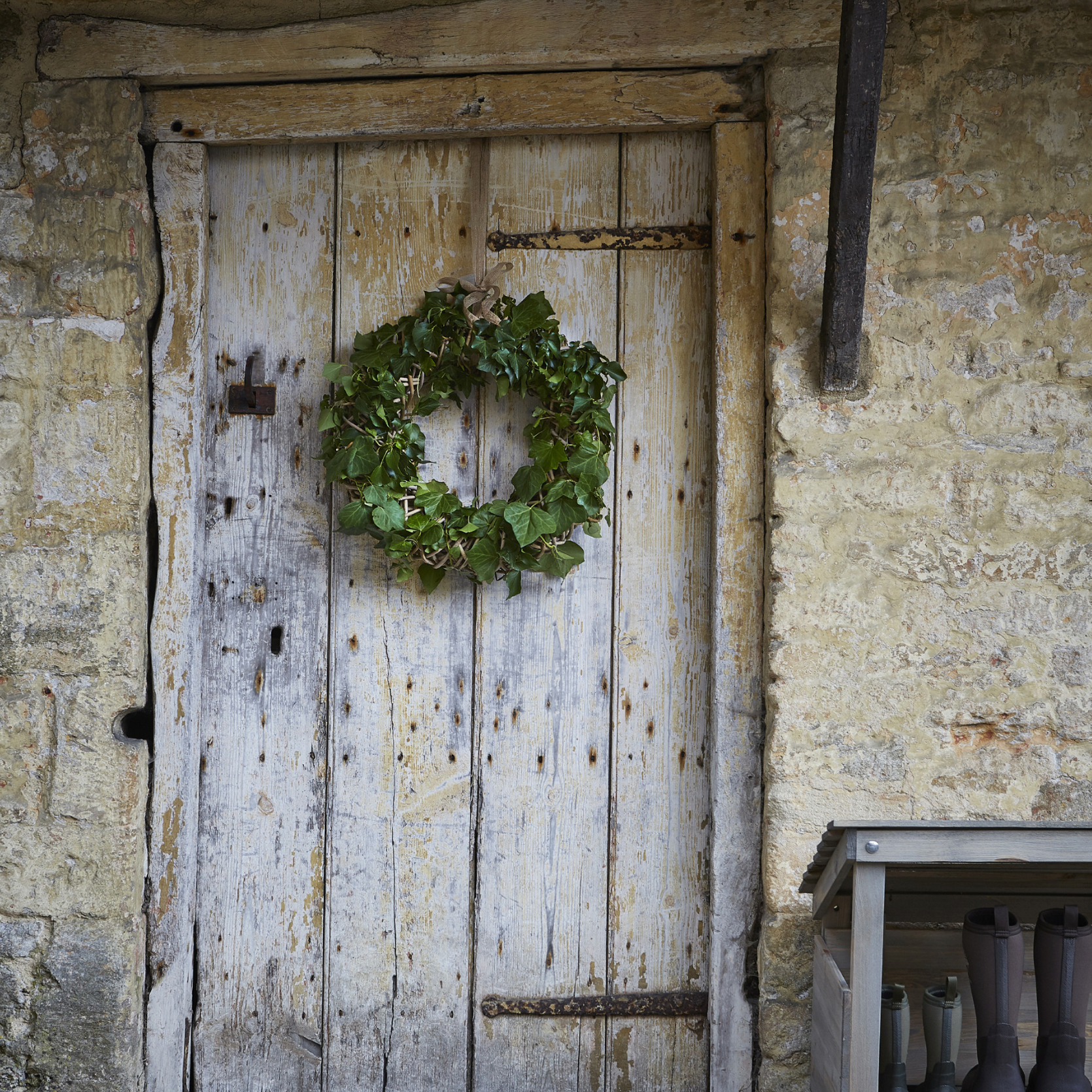 Green door wreath on barn door.