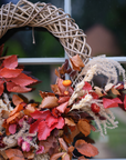 Autumn Wreath with orange foliage on front door.