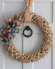 Autumn Wreath with orange foliage on front door.