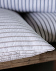A close up a striped cushion. 