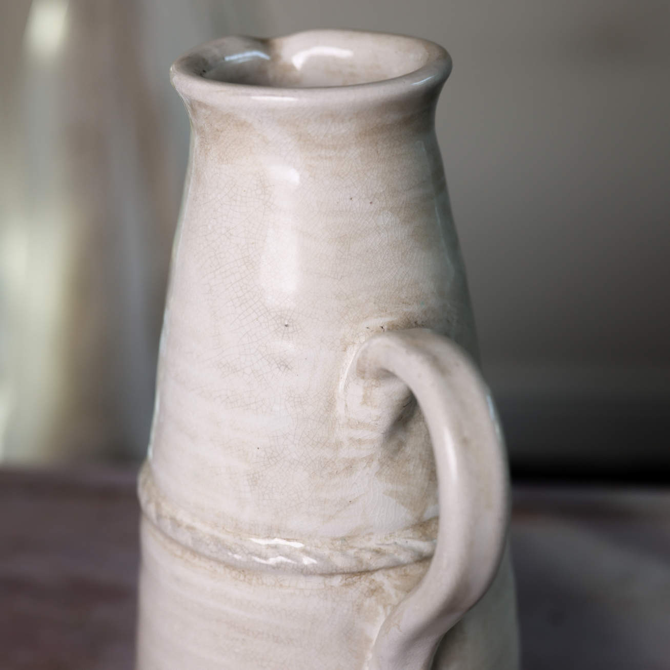 Close up of spout on large cream vintage jug.