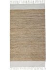 White and natural cotton and jute rug with tassels.