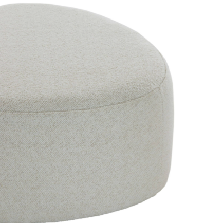 Close up of beige pouf.