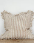 Light brown striped cushion with ruffled frayed edge.