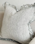 Linen pinstripe ruffle cushion with frayed edge.