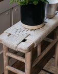 The rope detail on the Lulworth Rustic Wooden Side Table, with a plant in a black ceramic pot.