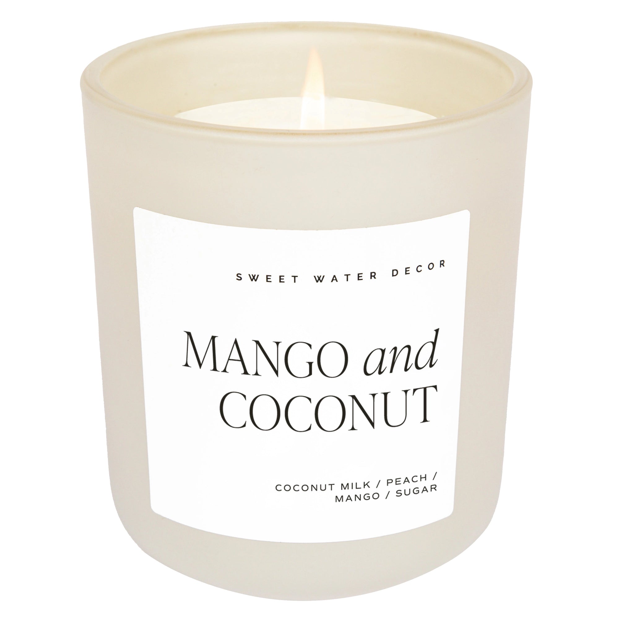 Mango and coconut soy wax candle in matte white jar.