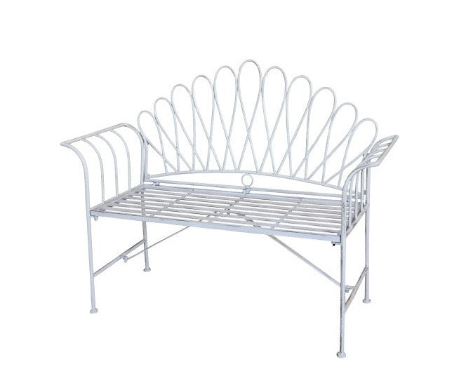 White outdoor bench with scalloped edge.