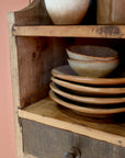 Close up of natural grain on small wooden shelf with drawer.