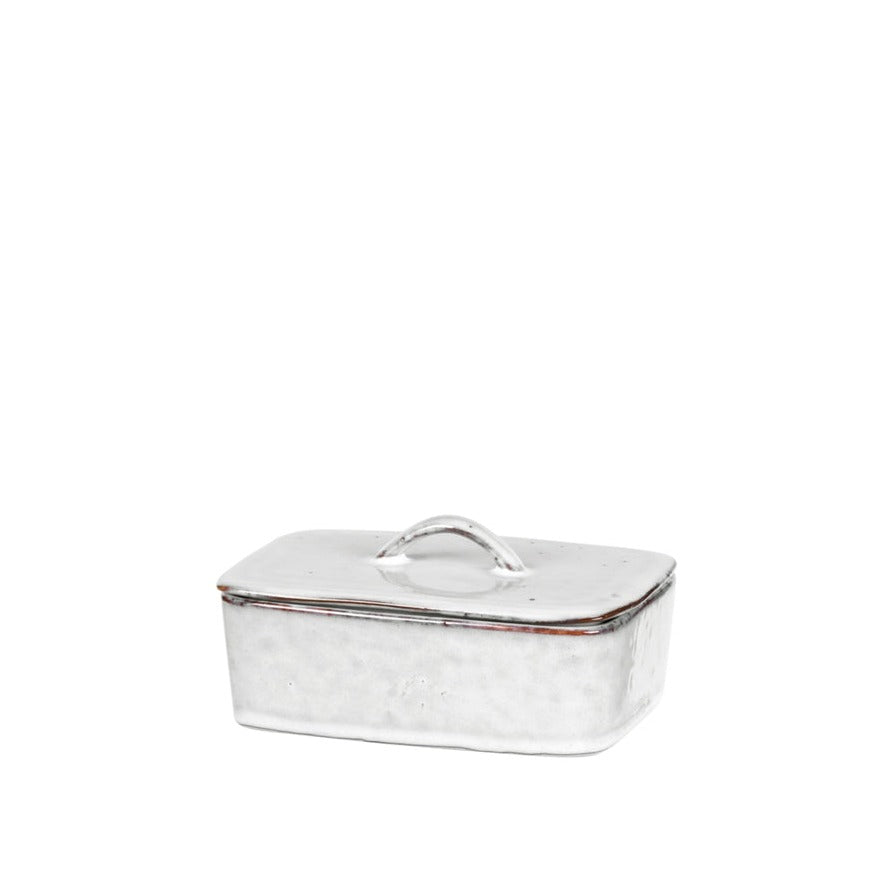Off white speckled butter dish with lid.